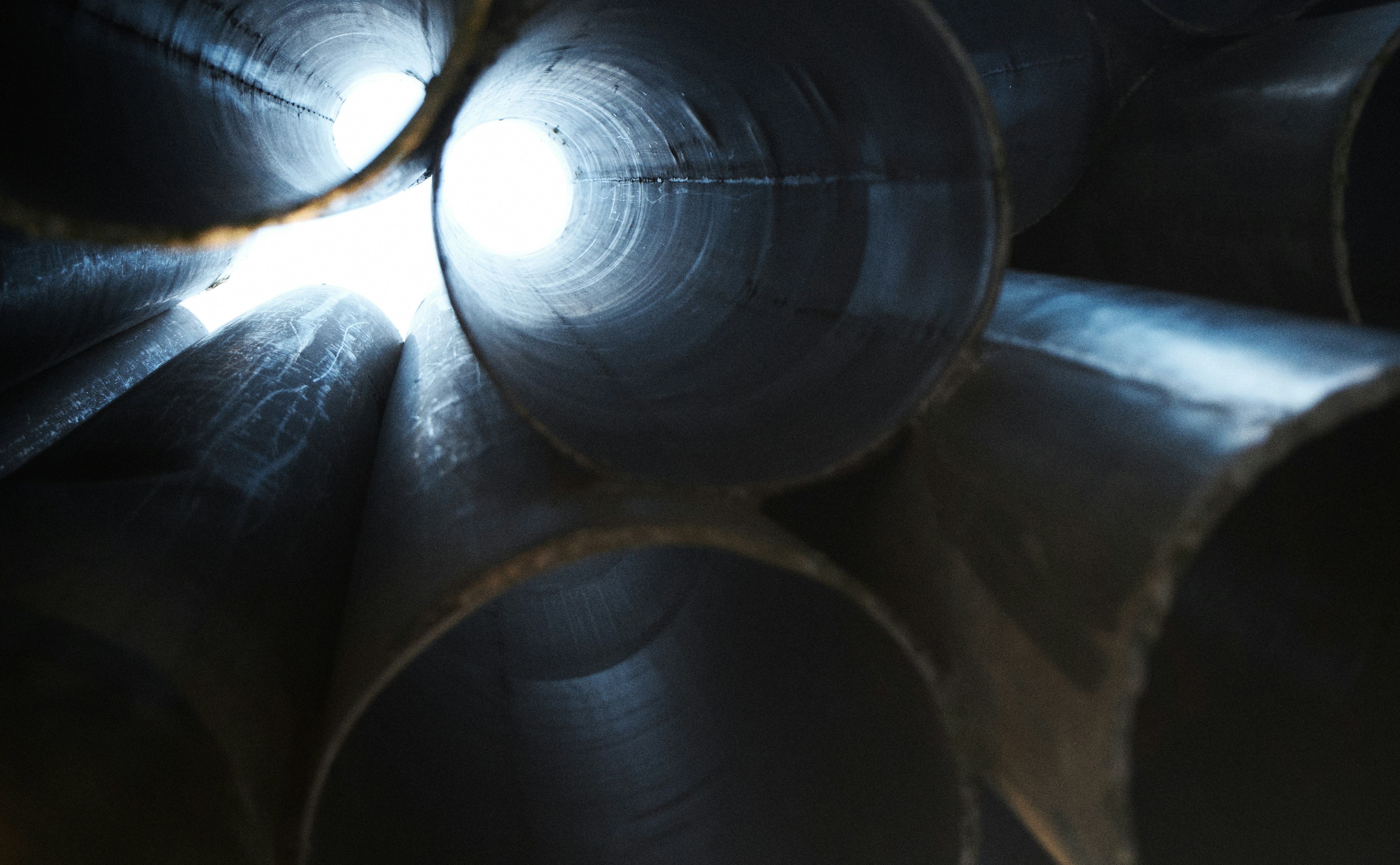 Sibelius Monument organ pipes seen from below. Inside the cylinders: light pouring through metal tubes